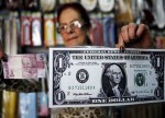 Dólar cai ante real com correção, mas cautela continua com andamento de reformas