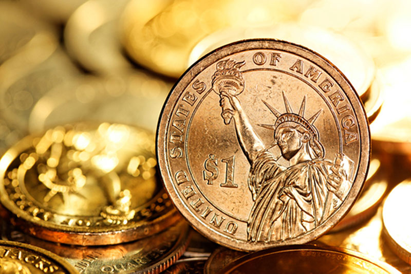 Dollar holds gains in Asia